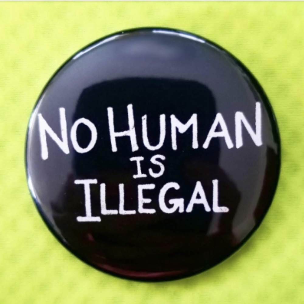 2.25 inch no human is illegal button badge pin
